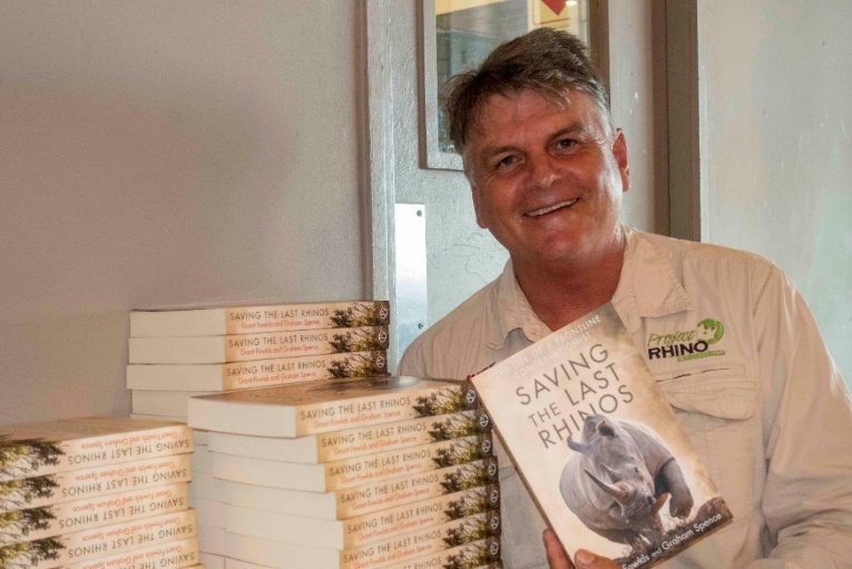 Grant signing his Saving the Last Rhinos book
